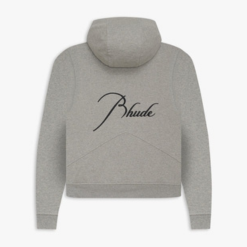 Rhude Clothing is a popular streetwear brand known for its stylish and modern designs. Founded by Rhuigi Villaseñor in 2015, the brand has quickly gained a strong following among fashion lovers, celebrities, and sneaker enthusiasts. With a blend of luxury and casual aesthetics, Rhude has become a go-to choice for those who want to stand out in street fashion. The Story Behind Rhude Clothing Rhuigi Villaseñor, the creative mind behind Rhude, was born in the Philippines and later moved to Los Angeles. His background and personal experiences have played a huge role in shaping the brand’s identity. With no formal fashion training, Villaseñor started designing clothes from his home, using inspiration from music, culture, and art. His breakthrough came when celebrities started wearing his designs, and Rhude quickly became a recognized name in the industry. The Style of Rhude Clothing Rhude Clothing is famous for its bold graphics, high-quality fabrics, and relaxed fits. The brand merges streetwear with luxury, creating pieces that feel both stylish and comfortable. The designs often mix vintage and modern aesthetics, giving them a timeless yet trendy appeal. Many of its pieces feature unique patterns, oversized silhouettes, and distressed details. This combination of elements makes Rhude a standout in the world of street fashion. Rhude’s clothing is also known for its muted color palettes, often using earth tones and neutral shades like beige, black, olive, and brown. These colors give a sophisticated and understated look while still maintaining a cool, streetwear edge. Popular Rhude Clothing Items Rhude offers a variety of clothing items that have become staples in the streetwear community. Some of the most well-known Rhude pieces include: T-Shirts Rhude t-shirts often feature eye-catching prints and logos. The brand frequently incorporates vintage-inspired graphics, giving the shirts a unique and nostalgic feel. Many of their designs include motorcycle or racing themes, reflecting Villaseñor’s love for car culture. Hoodies & Sweatshirts Rhude’s hoodies and sweatshirts are known for their oversized fit and premium materials. These pieces often include bold text, embroidered details, and minimalist designs, making them perfect for casual yet stylish outfits. Jackets Rhude jackets range from bomber jackets to workwear-inspired coats. They blend classic designs with modern twists, such as oversized fits, unique pocket placements, and high-end fabrics. These jackets are often priced higher due to their craftsmanship and premium materials. Shorts & Pants Rhude’s shorts and pants are some of the most iconic items in the brand’s lineup. Their Rhude Traxedo Shorts, for example, feature a track-pant-inspired look with drawstrings, side stripes, and a relaxed fit. These shorts have been worn by multiple celebrities and are highly sought after. The brand also offers stylish cargo pants, jeans, and sweatpants, often featuring relaxed fits and vintage-inspired designs. Sneakers & Footwear Rhude has collaborated with several major brands like Puma and Vans to release exclusive sneakers. These collaborations bring Rhude’s signature style to footwear, creating unique and limited-edition designs that sneakerheads love. Why Is Rhude Clothing So Popular? Rhude Clothing’s rise to fame can be attributed to several key factors: 1. Celebrity Endorsements Many celebrities, including Kendrick Lamar, LeBron James, and A$AP Rocky, have been seen wearing Rhude. This exposure has helped the brand gain a wider audience and solidify its reputation as a must-have streetwear label. 2. High-Quality Craftsmanship Rhude pieces are made from premium materials, making them more luxurious than typical streetwear brands. The high level of craftsmanship and attention to detail set Rhude apart from mass-produced clothing. 3. Limited Releases & Exclusivity Rhude frequently releases clothing in limited quantities, making certain items highly sought after. This scarcity creates demand, as fashion enthusiasts rush to grab pieces before they sell out. 4. Unique Aesthetic The combination of luxury, vintage, and streetwear influences gives Rhude a distinctive look that appeals to a wide range of fashion lovers. Whether it’s a t-shirt, hoodie, or pair of shorts, each Rhude piece carries a signature style that’s instantly recognizable. Rhude Collaborations & Partnerships Rhude has worked with several major brands and companies to create exclusive collections. Some notable collaborations include: Rhude x Puma – This collaboration brought Rhude’s bold design aesthetic to Puma sneakers and apparel, resulting in sleek and stylish footwear options. Rhude x Vans – Featuring unique designs and high-quality materials, Rhude’s Vans collab reimagined classic sneaker silhouettes with a fresh perspective. Rhude x McLaren – This collection showcased racing-inspired apparel, blending McLaren’s automotive heritage with Rhude’s streetwear sensibilities. These collaborations have further cemented Rhude’s reputation in the fashion industry, making it one of the most exciting streetwear brands to watch. Where to Buy Rhude Clothing Rhude Clothing is available at several high-end fashion retailers, both online and in-store. Some of the best places to shop for Rhude include: Official Rhude Website – The best place to find the latest collections and exclusive releases. Luxury Retailers – Stores like SSENSE, Farfetch, and Mr Porter often carry Rhude’s latest drops. Streetwear Boutiques – Select boutiques specialize in high-end streetwear and may have limited Rhude pieces available. Resale Marketplaces – Due to its limited releases, many Rhude items can be found on platforms like Grailed, StockX, and GOAT. Rhude Clothing Pricing & Value Rhude is considered a high-end streetwear brand, so its pricing reflects its premium quality. Expect to pay: $150 – $300 for t-shirts $300 – $600 for hoodies & sweatshirts $500 – $1,500 for jackets $300 – $700 for pants & shorts $150 – $500 for sneakers While the prices may be steep, many fashion enthusiasts believe Rhude’s craftsmanship and exclusivity make it worth the investment. Final Thoughts Rhude Clothing has made a significant impact on the streetwear industry with its unique blend of luxury, vintage, and casual aesthetics. With high-profile celebrity endorsements, limited-edition releases, and collaborations with major brands, Rhude continues to grow as a leading name in fashion. For those who appreciate quality and standout designs, Rhude Clothing is a brand worth exploring. Whether you’re looking for a statement piece or a stylish everyday outfit, Rhude offers something for every streetwear lover. With its strong identity and forward-thinking vision, Rhude is not just a brand—it's a movement that continues to influence the culture of modern fashion.