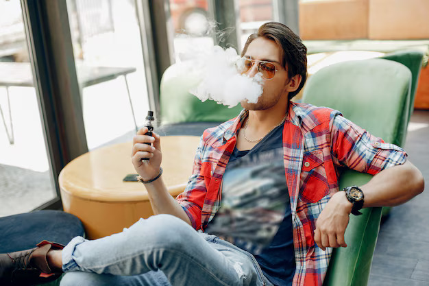 stylish elegant man sitting cafe with vape 1157 34786