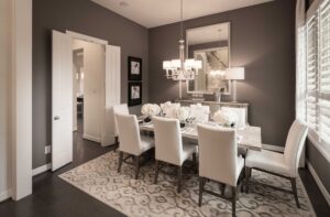 Round dining room rugs with a round table and upholstered chairs in a cozy dining area