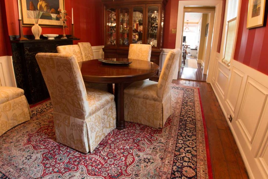 Round dining room rugs with a round table and upholstered chairs in a cozy dining area